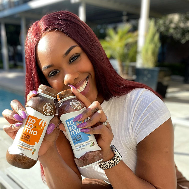 Influencer Justine Coney with Kokomio bottles