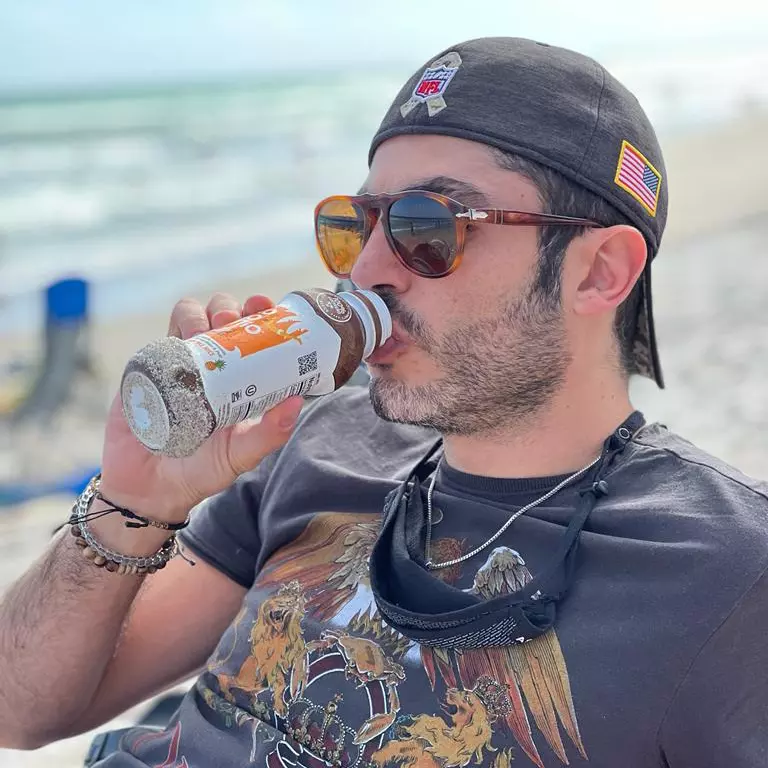 Drinking Kokomio at the beach